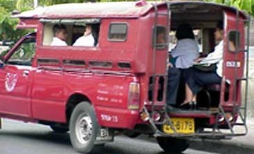 Travelling Around by Songthaew -   Randy Gaudet